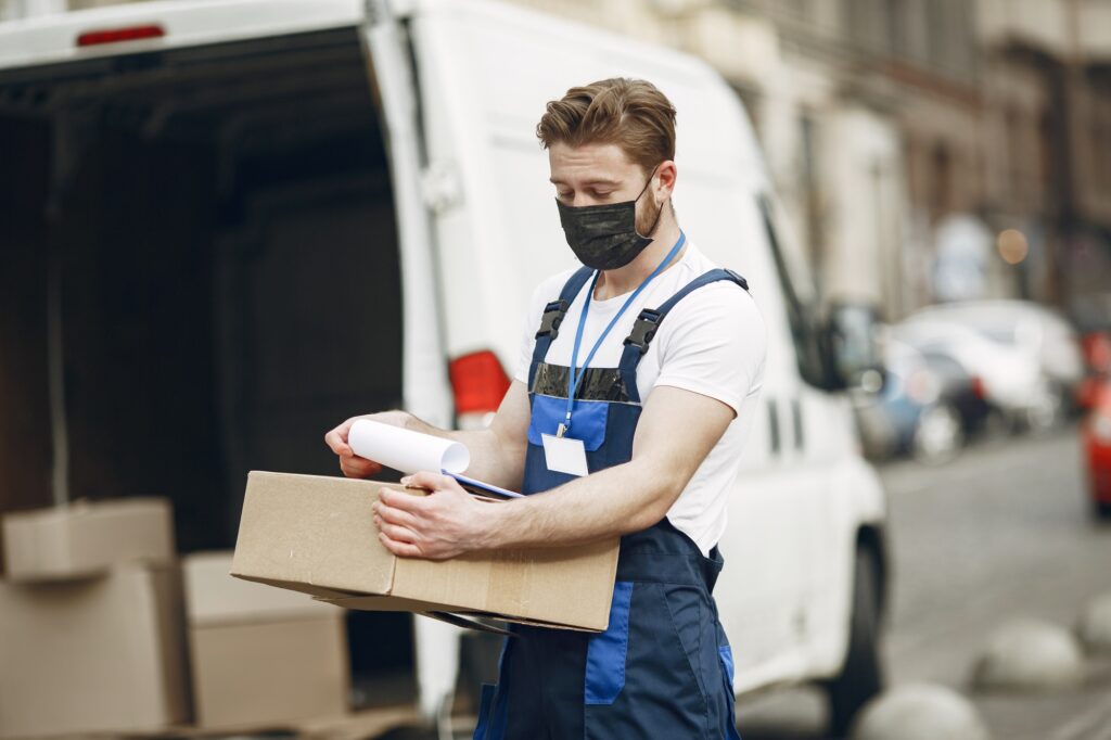 Delivery man with package outdoors